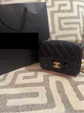 CHANEL Black Quilted Mini Flap Bag with Gold Hardware